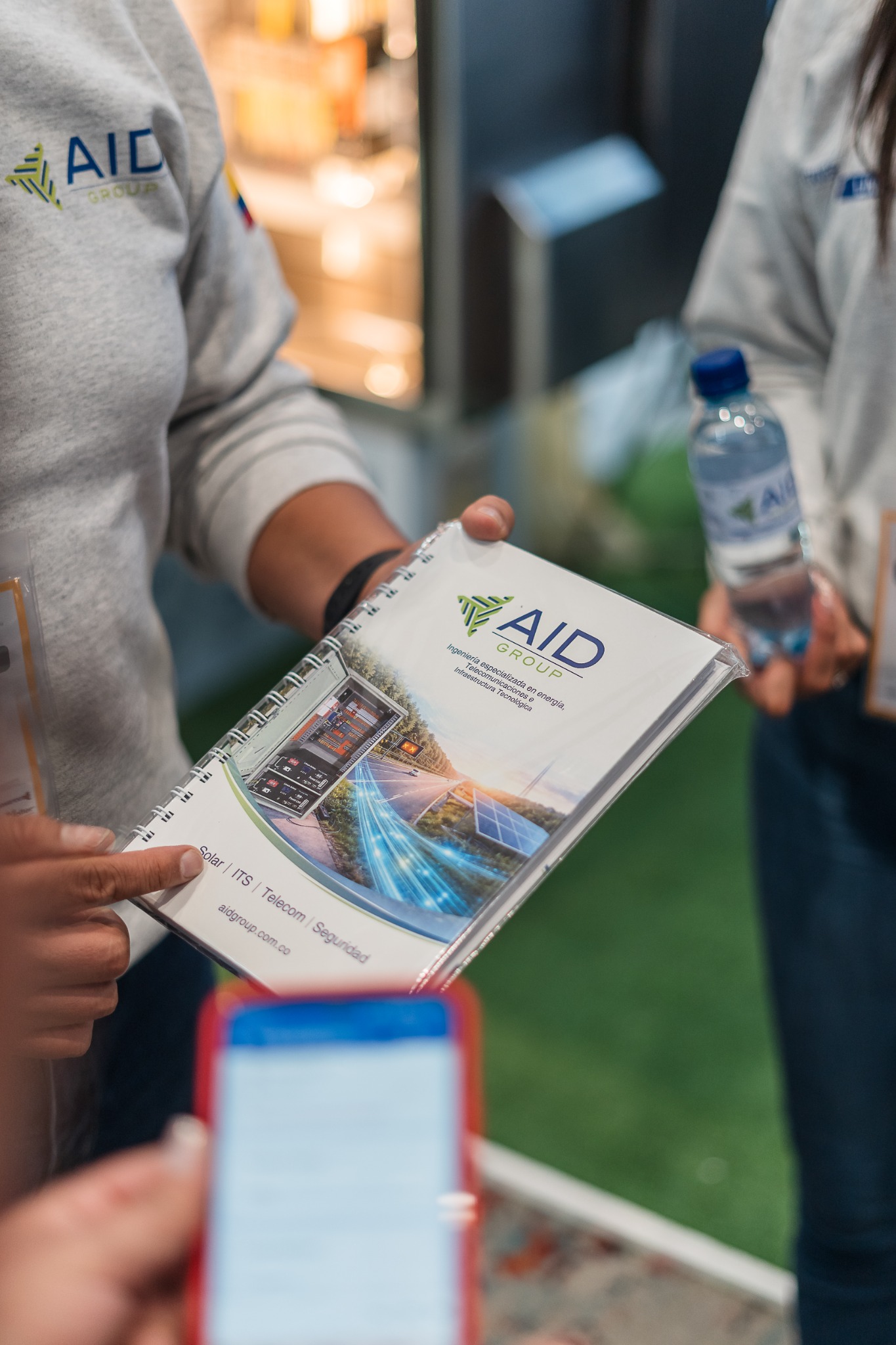 Evidencia 2 catálogo institucional de AID GROUP durante la feria
